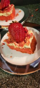 Strawberry Crumble Cake With a Strawberry on Top