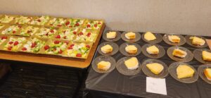 Plates of Slices of Cake and Salad Placed on a Table